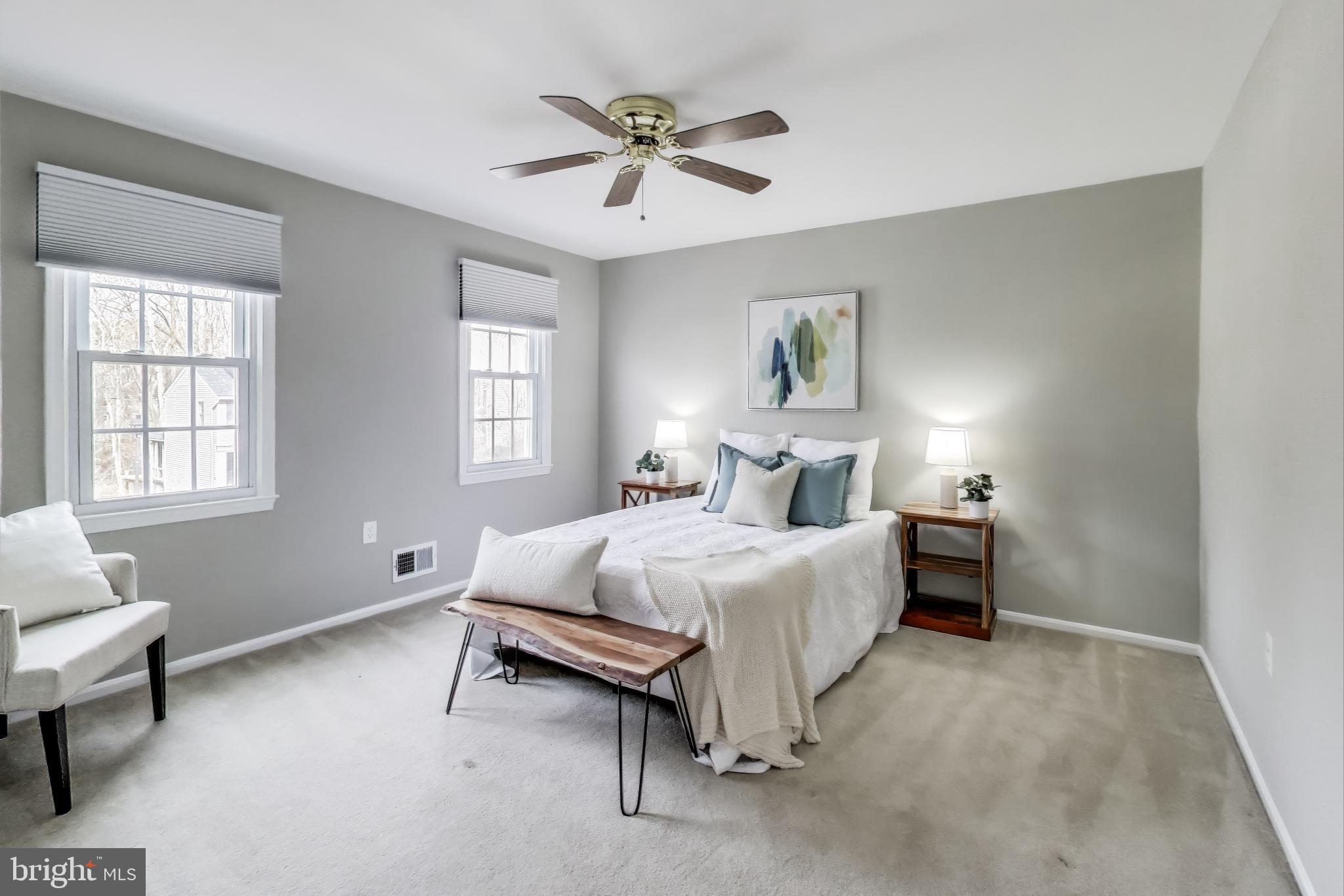 9023 Brook Ford Road Burke, VA 22015 - Photo 23 of 43 a bed room with a bed and a couch