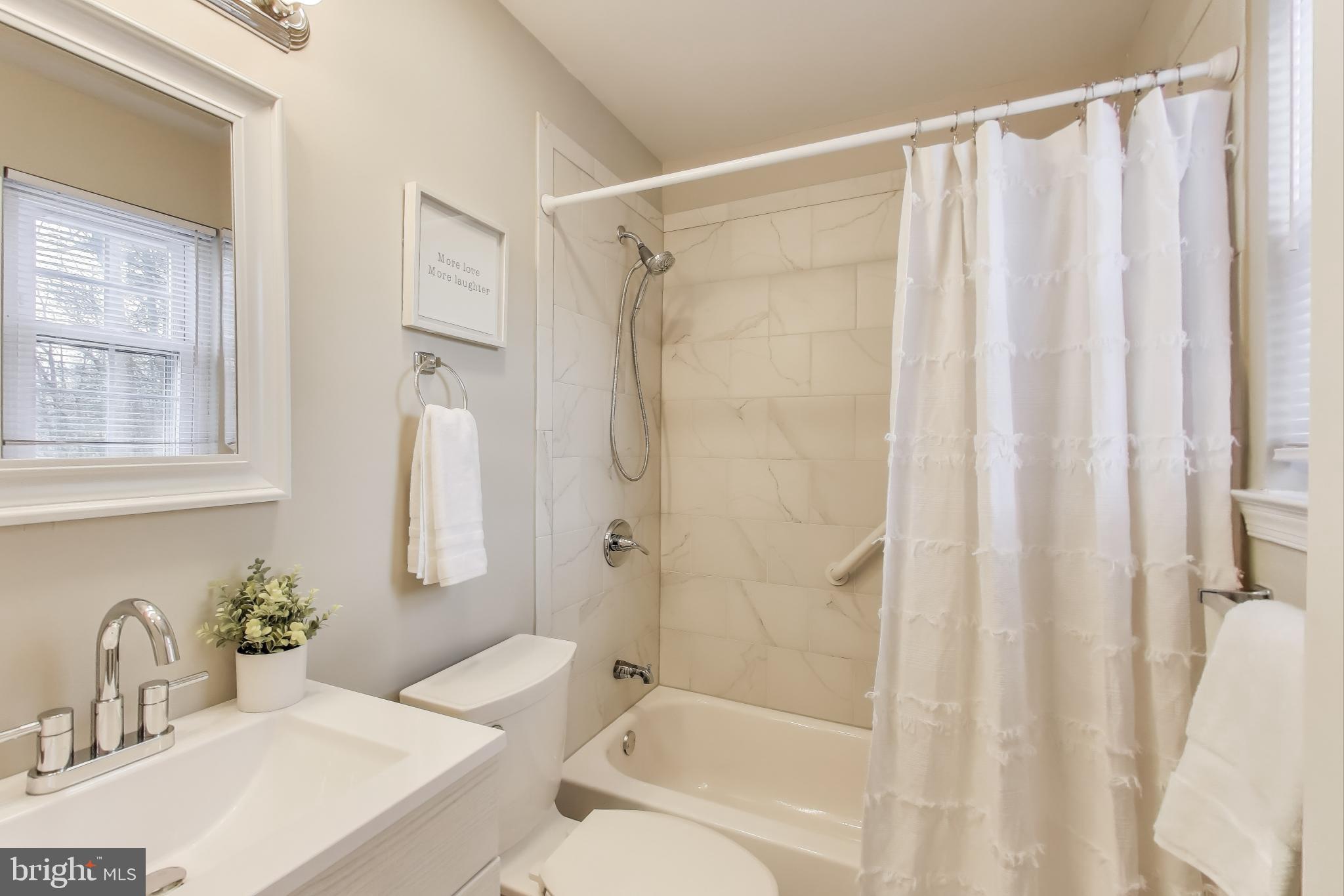 9023 Brook Ford Road Burke, VA 22015 - Photo 25 of 43 a bathroom with a sink toilet and shower