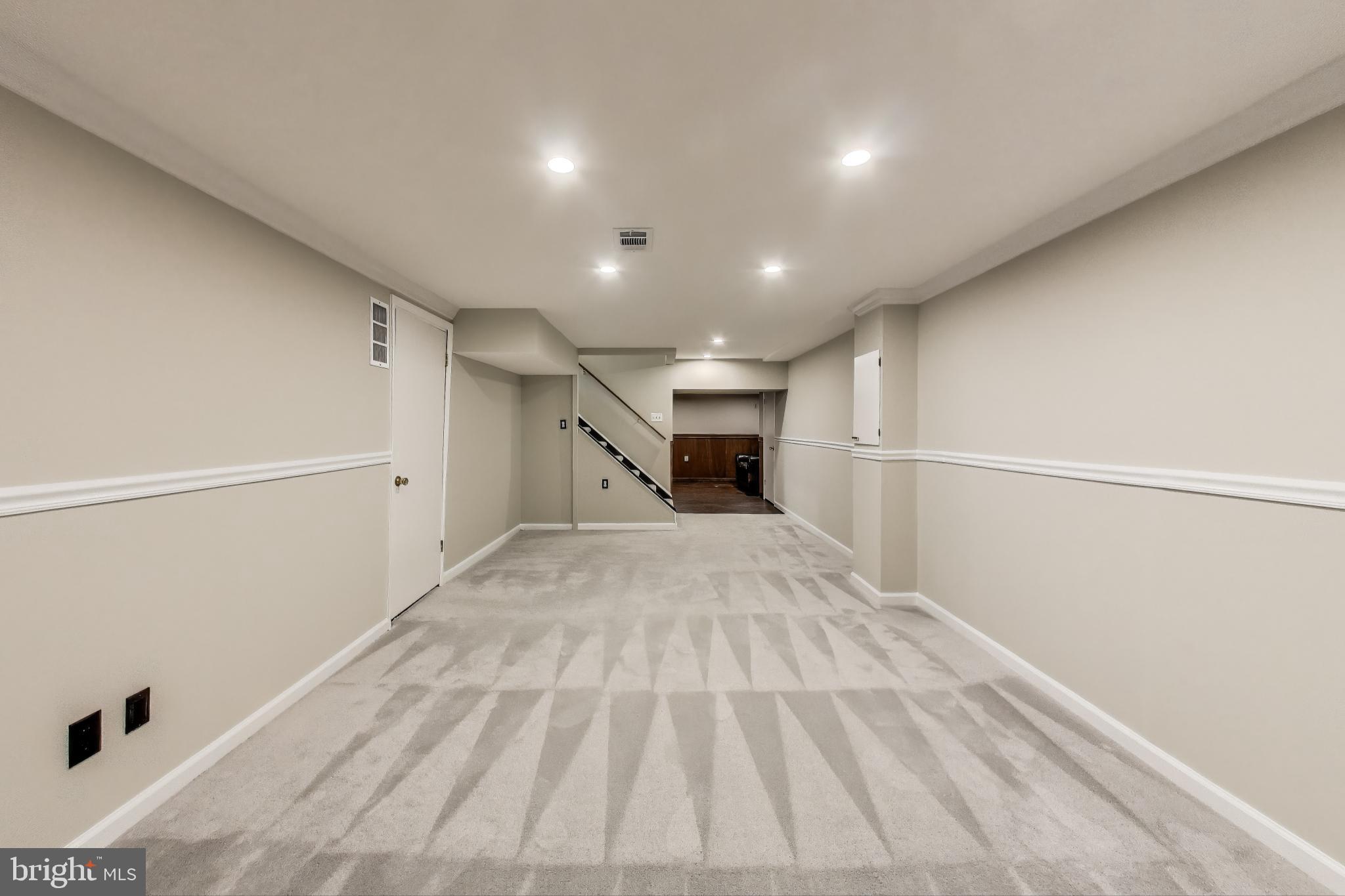 9023 Brook Ford Road Burke, VA 22015 - Photo 30 of 43 a view of empty room with wooden floor