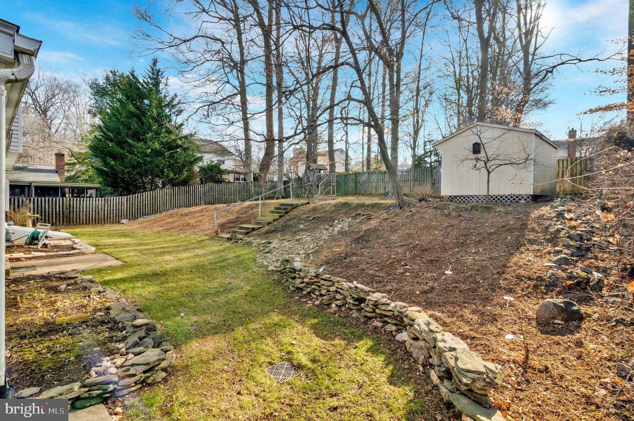 9023 Brook Ford Road Burke, VA 22015 - Photo 39 of 43 a view of a yard with yellow house
