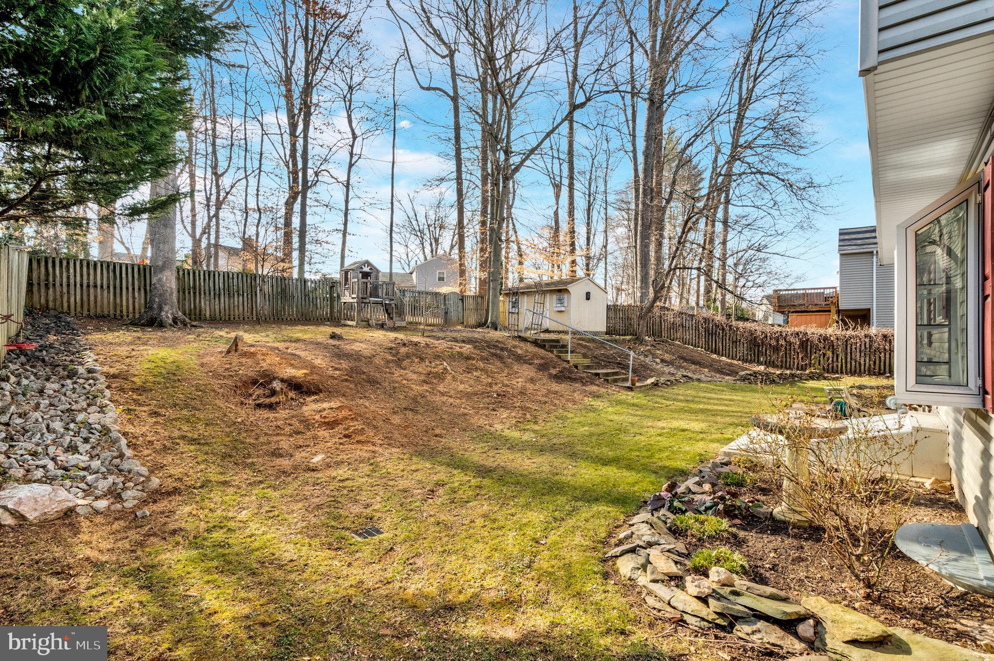 9023 Brook Ford Road Burke, VA 22015 - Photo 40 of 43 a view of a backyard with snow on the road