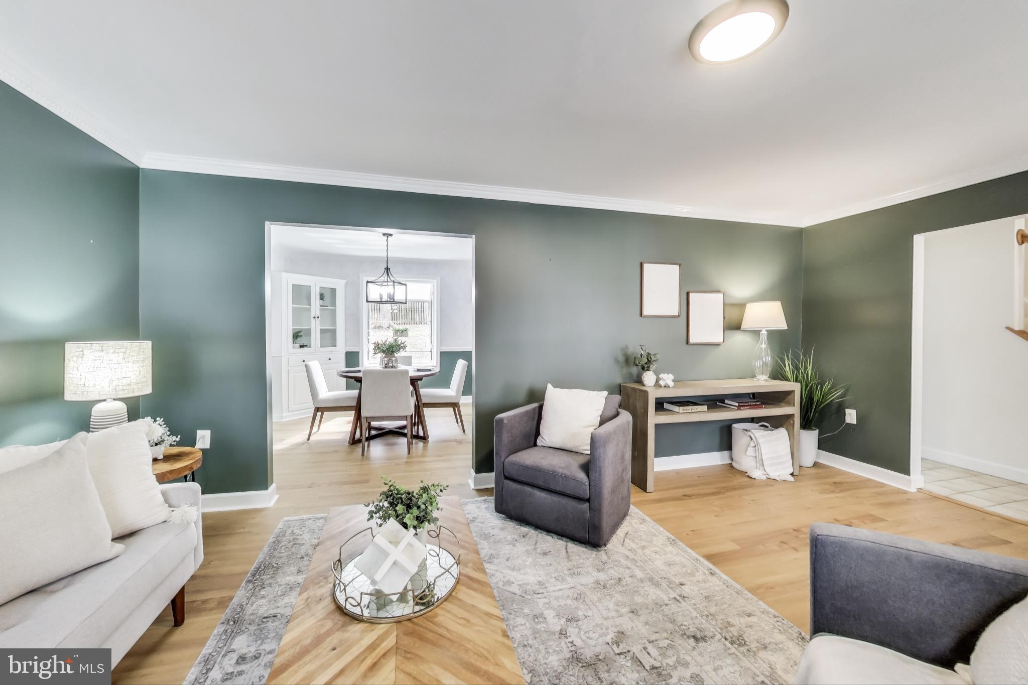 9023 Brook Ford Road Burke, VA 22015 - Photo 4 of 43 a living room with furniture and a table