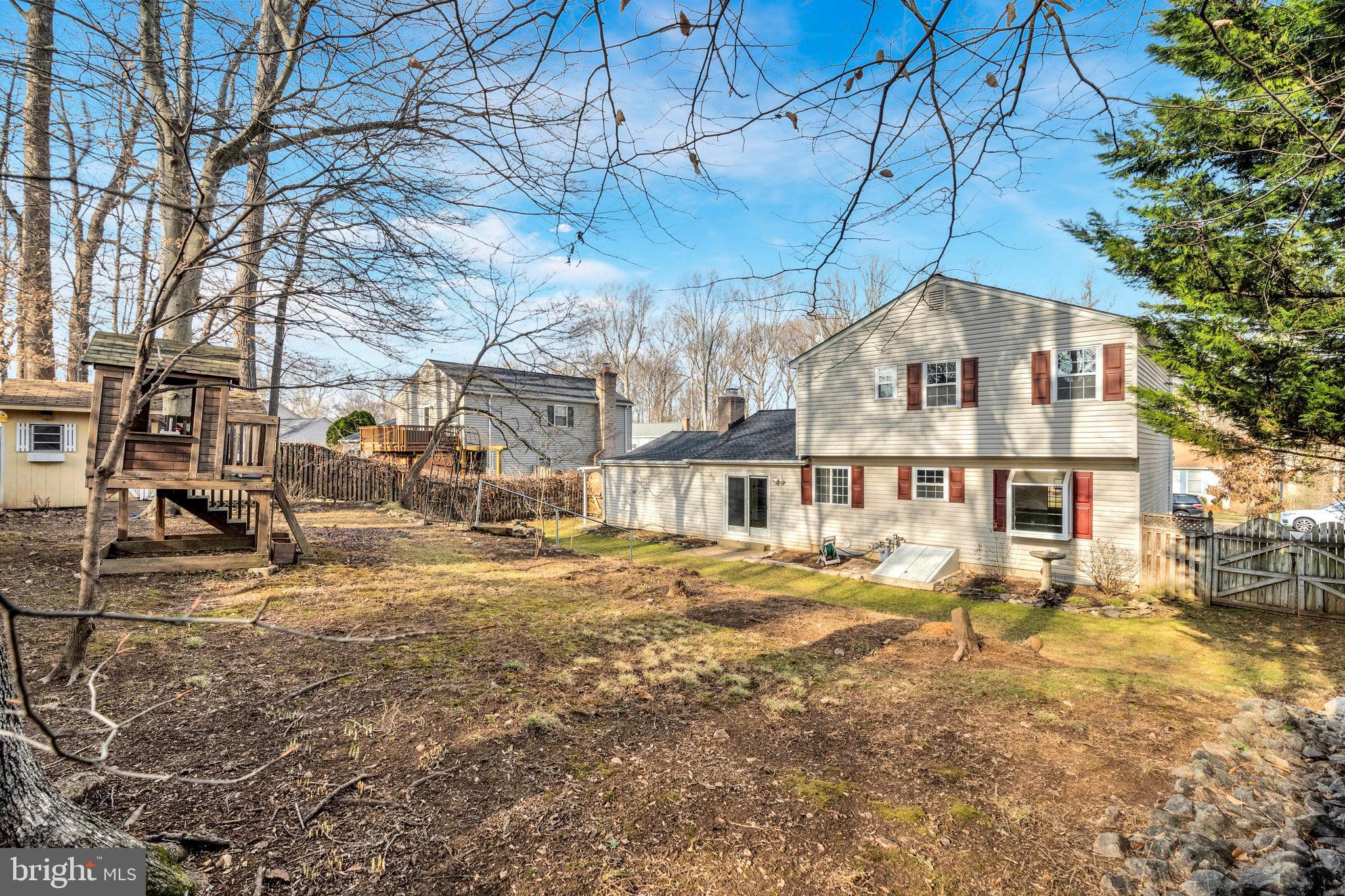 9023 Brook Ford Road Burke, VA 22015 - Photo 41 of 43 a front view of a house with a yard