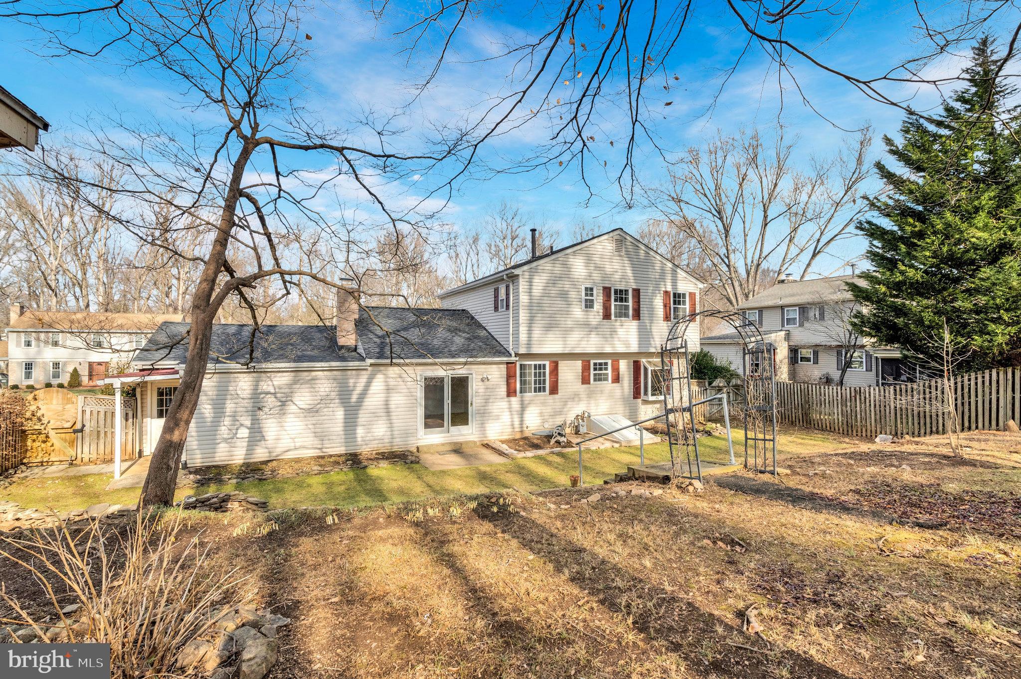 9023 Brook Ford Road Burke, VA 22015 - Photo 42 of 43 a front view of a house with a yard