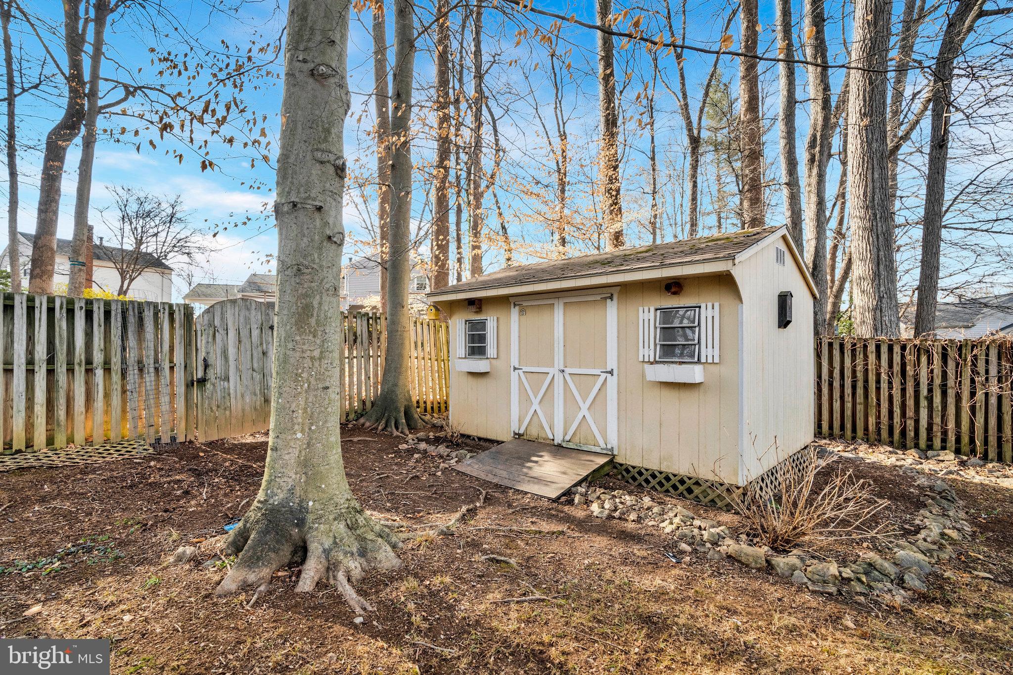 9023 Brook Ford Road Burke, VA 22015 - Photo 43 of 43 a front view of a house with a yard