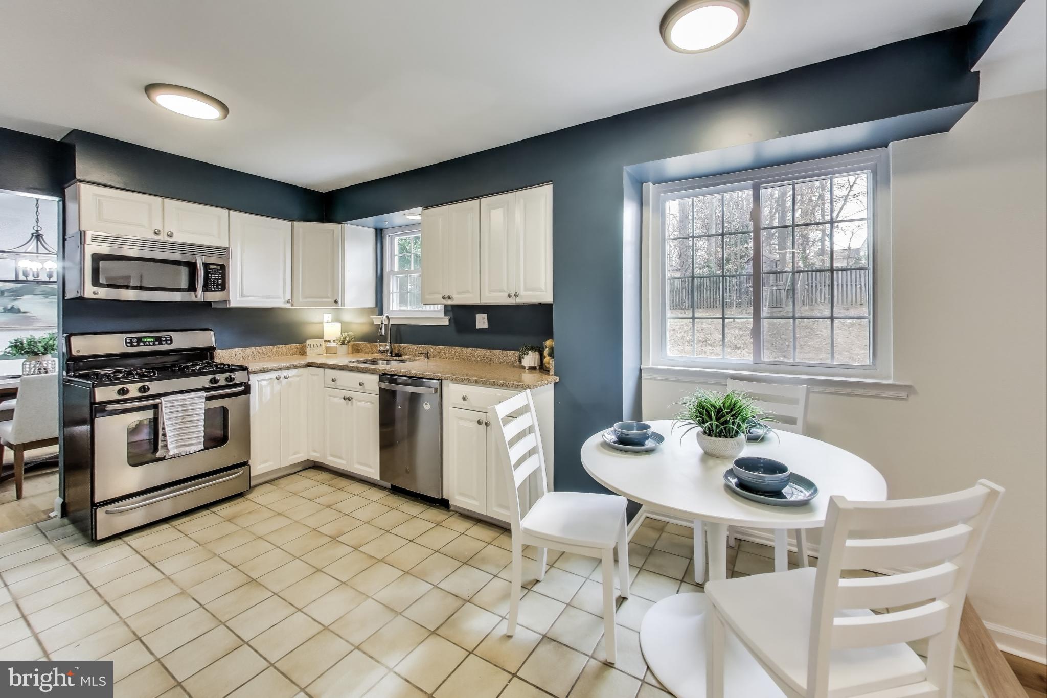 9023 Brook Ford Road Burke, VA 22015 - Photo 7 of 43 a kitchen with a sink cabinets and window