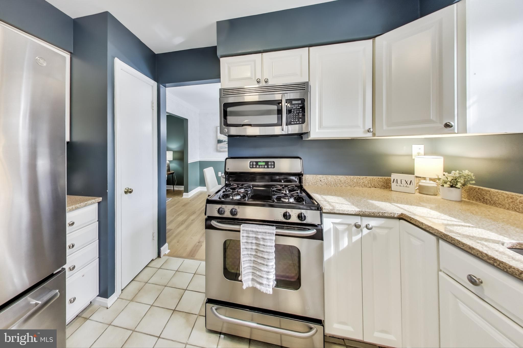 9023 Brook Ford Road Burke, VA 22015 - Photo 9 of 43 a kitchen with cabinets and steel stainless steel appliances