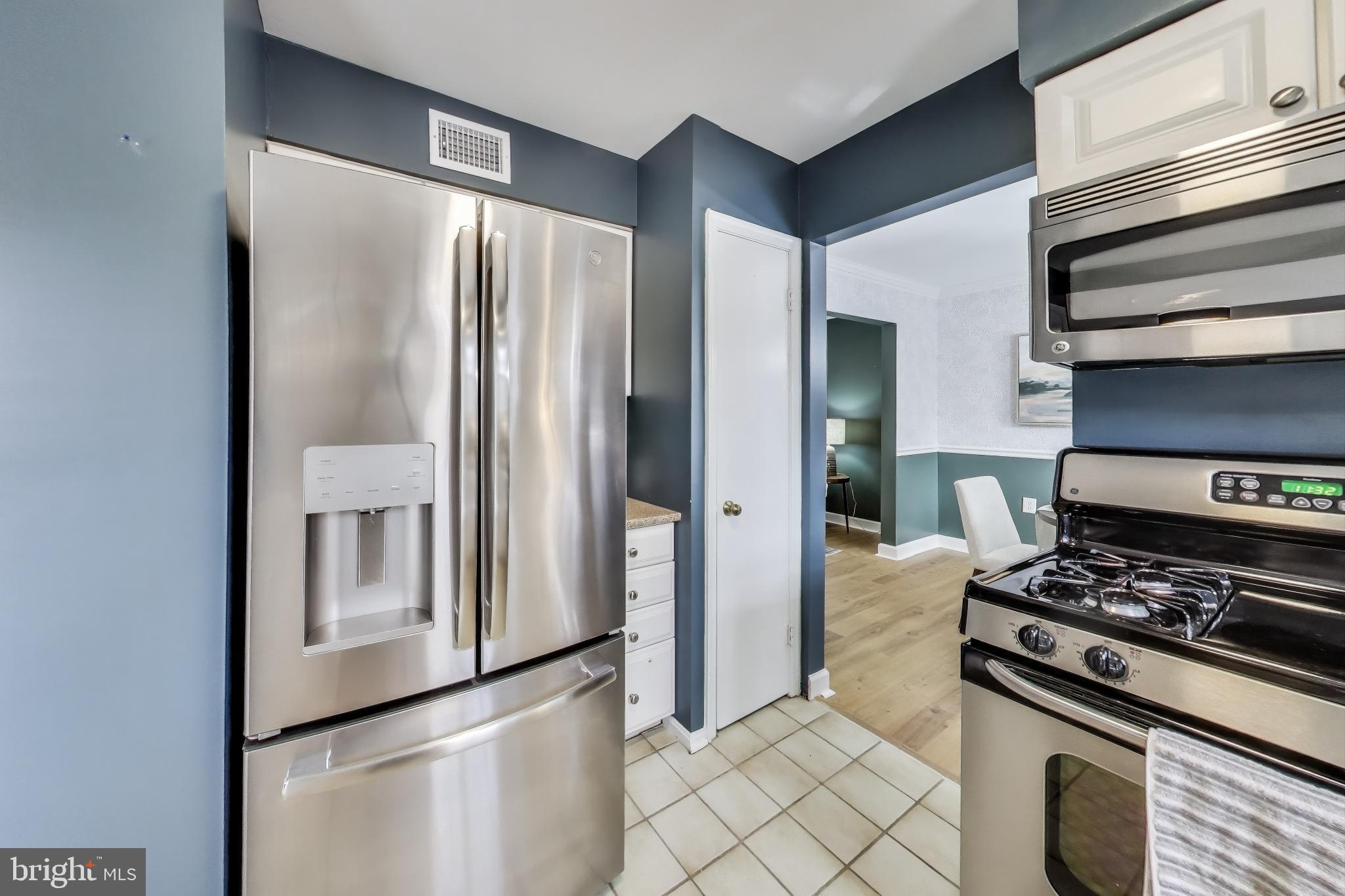 9023 Brook Ford Road Burke, VA 22015 - Photo 10 of 43 a kitchen with stainless steel appliances granite countertop a refrigerator and a stove