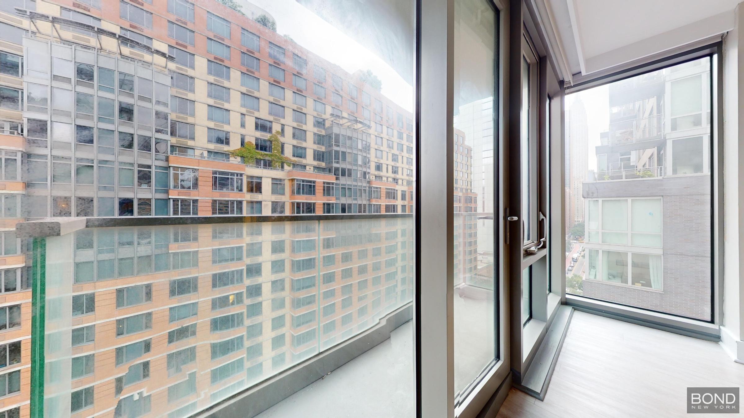 237 East 34th Street, Unit 1503 Manhattan, NY 10016 - Photo 12 of 24 a view of a city from a balcony