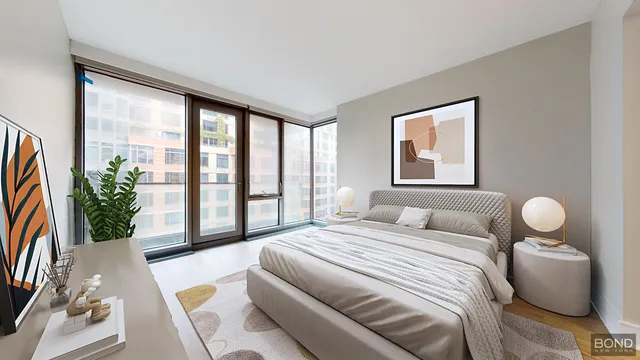 a bedroom with a bed and a potted plant
