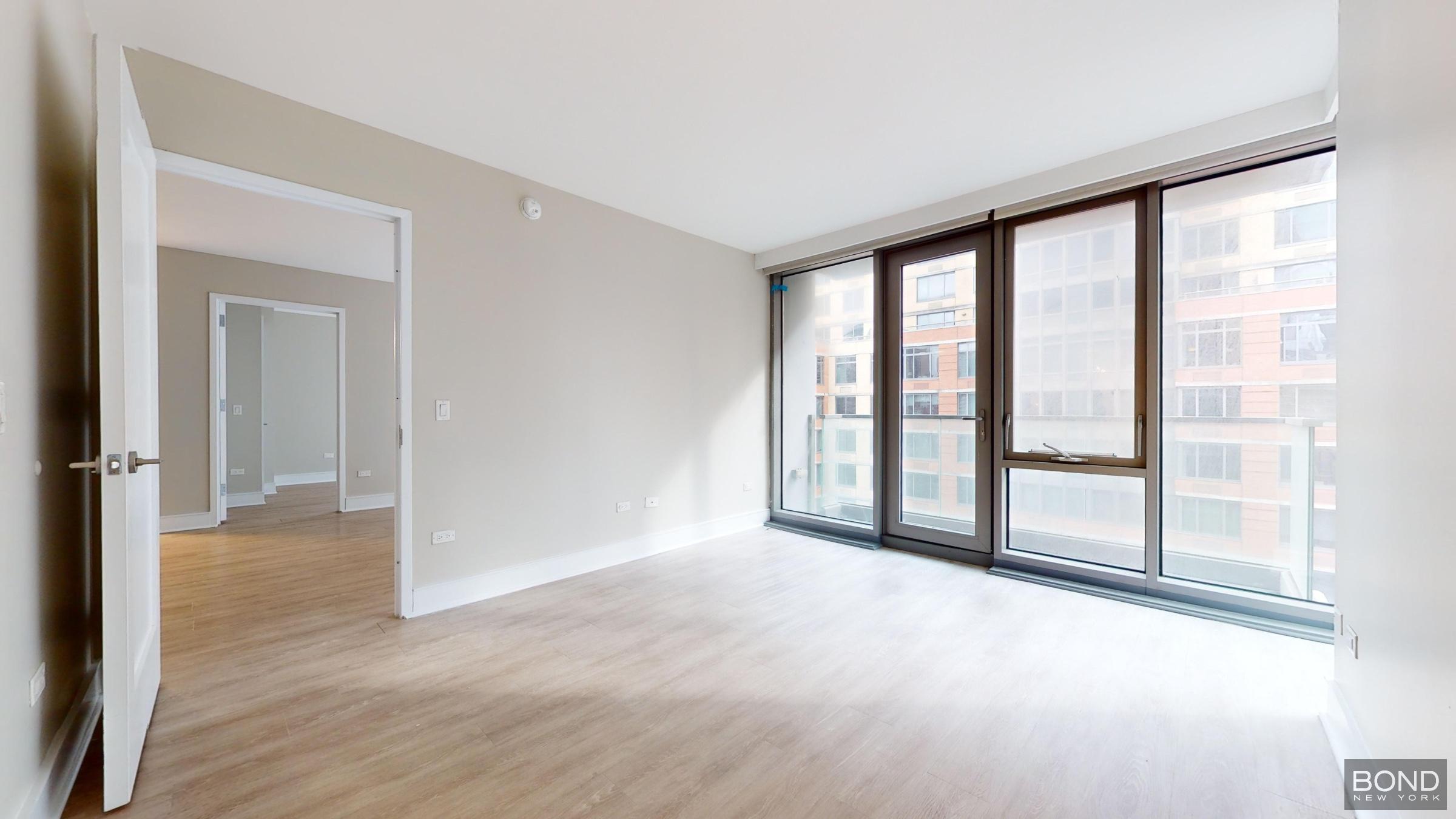 237 East 34th Street, Unit 1503 Manhattan, NY 10016 - Photo 8 of 24 wooden floor in an empty room with a window