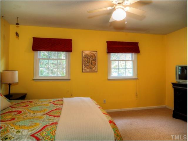 6375 New Market Way Raleigh, NC 27615 - Photo 13 of 20 a bedroom with a bed and a window