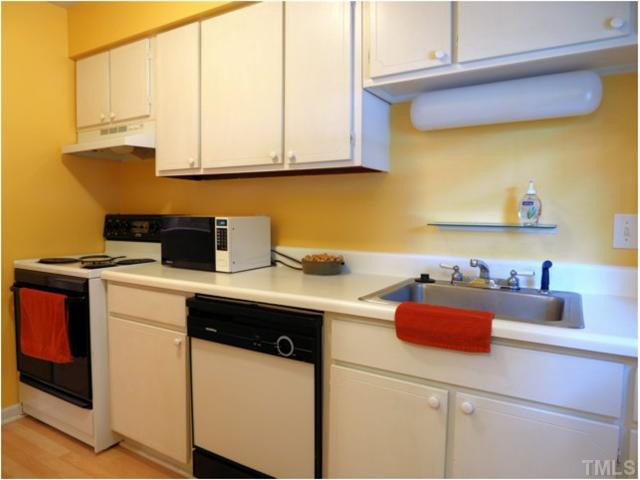 6375 New Market Way Raleigh, NC 27615 - Photo 3 of 20 a kitchen with a sink cabinets and appliances