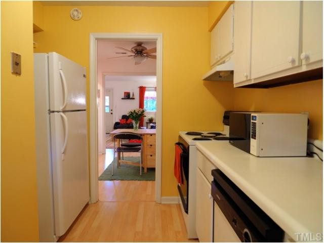 6375 New Market Way Raleigh, NC 27615 - Photo 5 of 20 a kitchen with a refrigerator and a stove