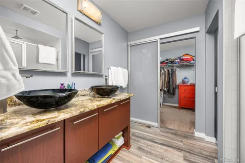 a kitchen with stainless steel appliances granite countertop a sink and a granite counter tops
