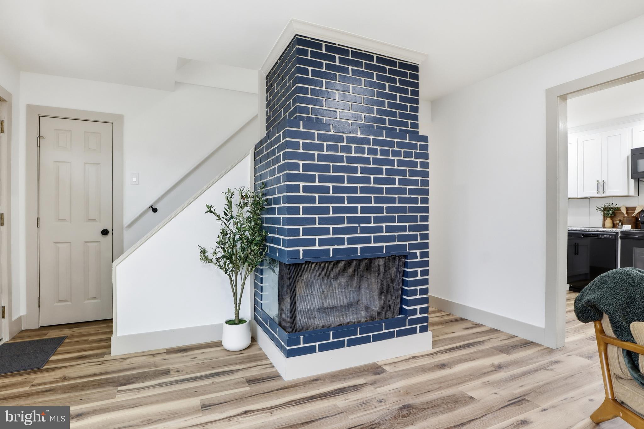 1512 Continental Road York, PA 17404 - Photo 4 of 23 a view of an empty room with wooden floor and a fireplace