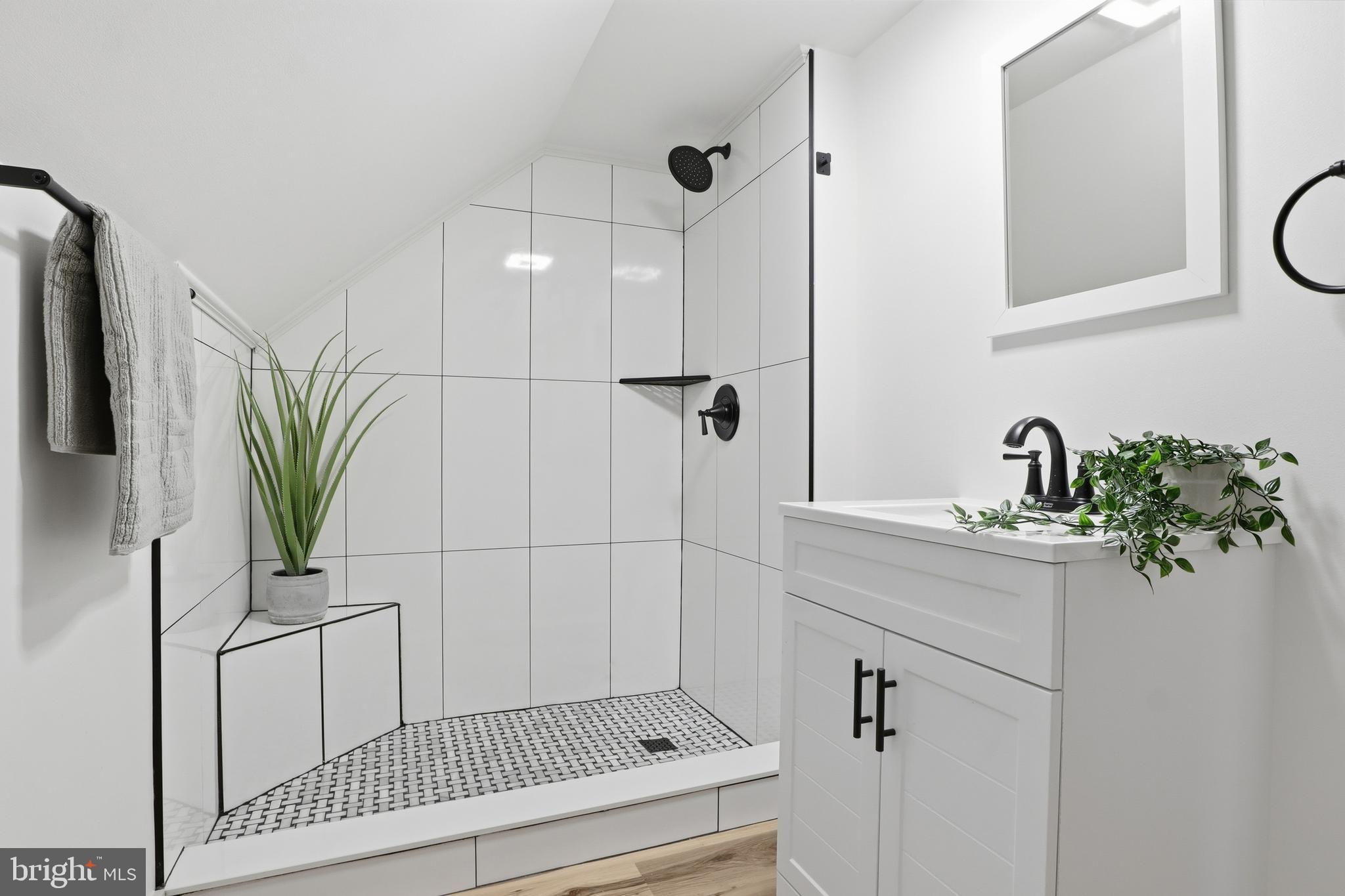 1512 Continental Road York, PA 17404 - Photo 8 of 23 a bathroom with a sink a potted plant and a mirror