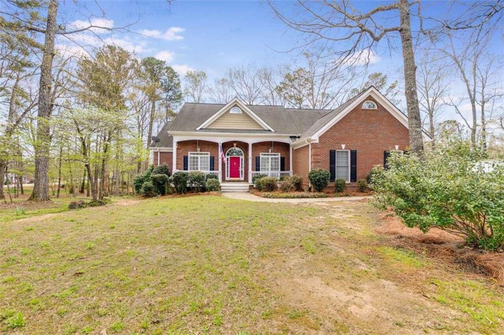 201 Carmel Ridge Road Canton, GA 30114 - Photo 1 of 1 a house with swimming pool in front of it