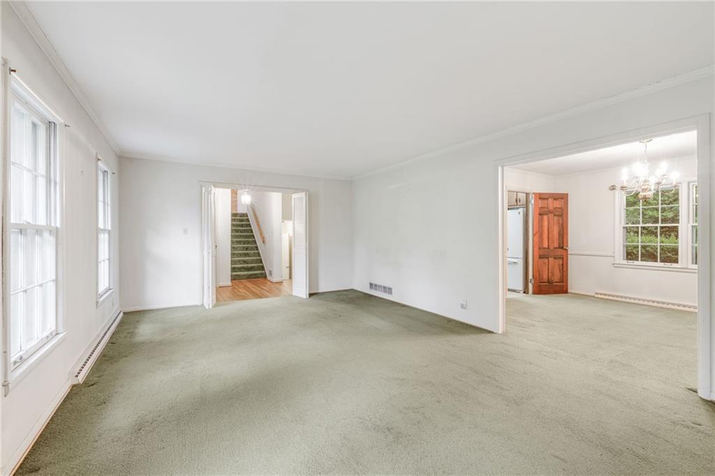 1911 Alderbrook Road Northeast Atlanta, GA 30345 - Photo 9 of 33 an empty room with windows