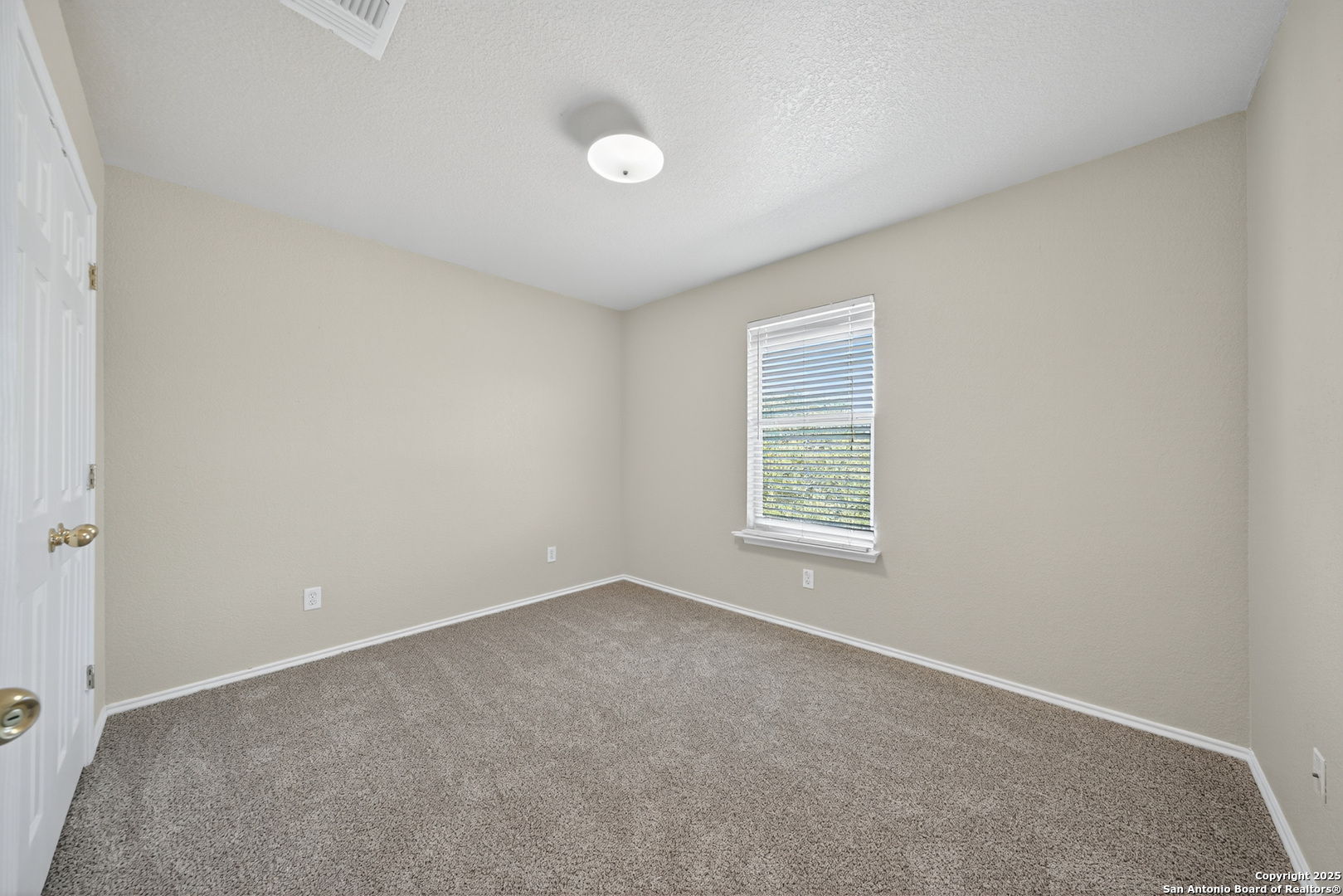 9619 Copper Spring Converse, TX 78109 - Photo 22 of 31 an empty room with a window