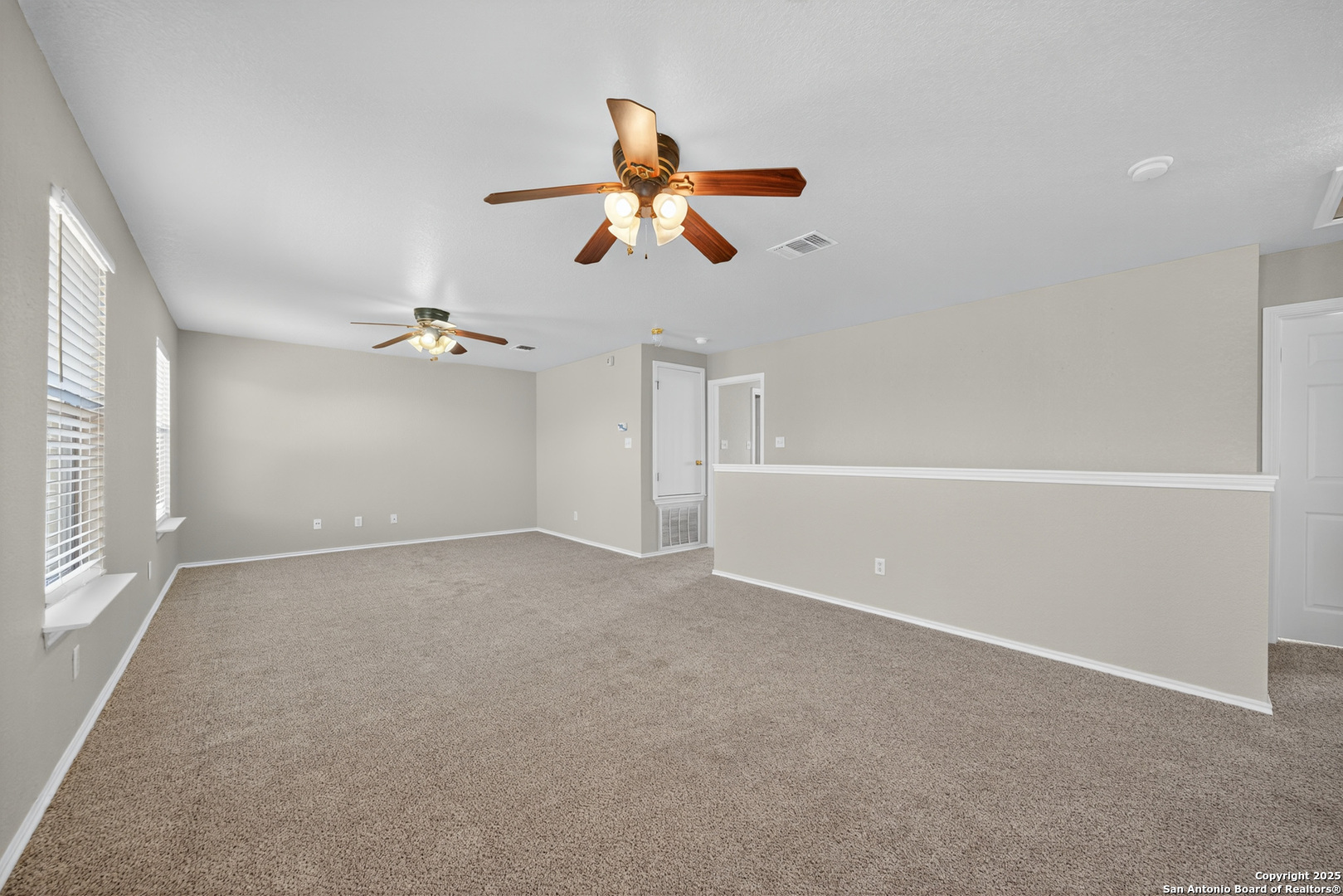 9619 Copper Spring Converse, TX 78109 - Photo 26 of 31 a view of empty room with a ceiling fan and window
