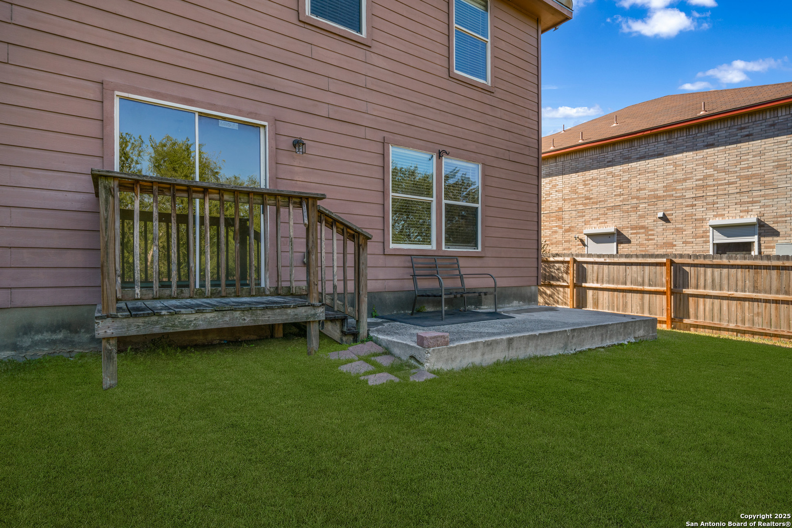 9619 Copper Spring Converse, TX 78109 - Photo 27 of 31 a front view of a house with a garden and patio