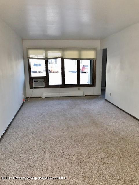 1151 Park Avenue Rifle, CO 81650 - Photo 2 of 9 a view of an empty room with a window