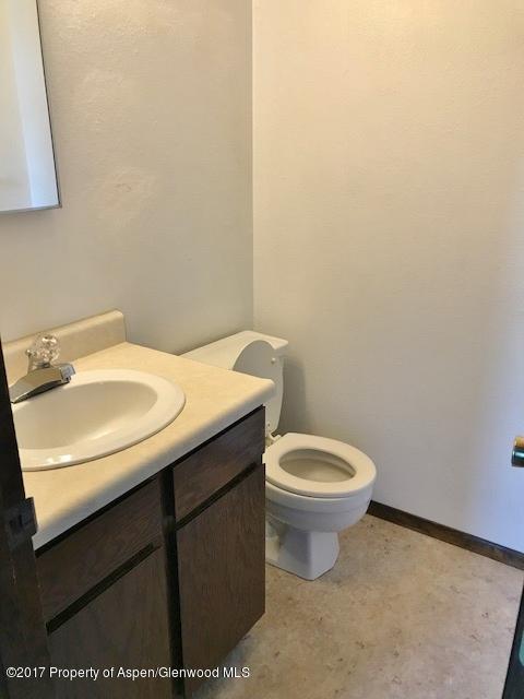 1151 Park Avenue Rifle, CO 81650 - Photo 6 of 9 a bathroom with a sink and a toilet