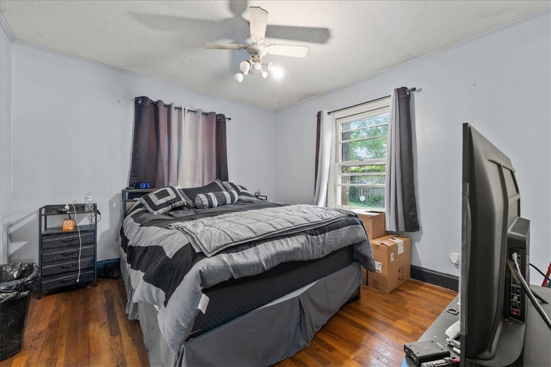 208 Holleman Street Seneca, SC 29678 - Photo 18 of 27 This spacious bedroom features classic hardwood floors and an inviting atmosphere.