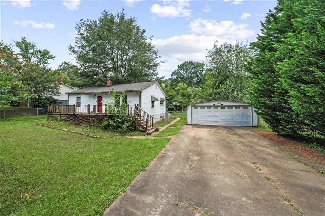 208 Holleman Street Seneca, SC 29678 - Photo 2 of 27 This charming residence features a classic facade, a welcoming deck, and a detached garage.