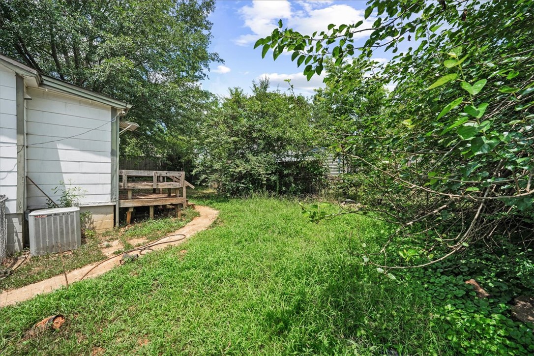 208 Holleman Street Seneca, SC 29678 - Photo 22 of 27 This spacious private yard includes a deck, offering outdoor living and entertaining possibilities.