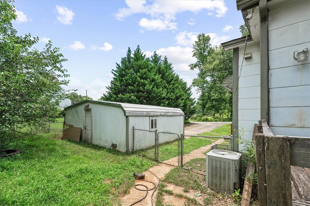208 Holleman Street Seneca, SC 29678 - Photo 26 of 27 This property features a useful storage shed, offering practical utility and convenience.
