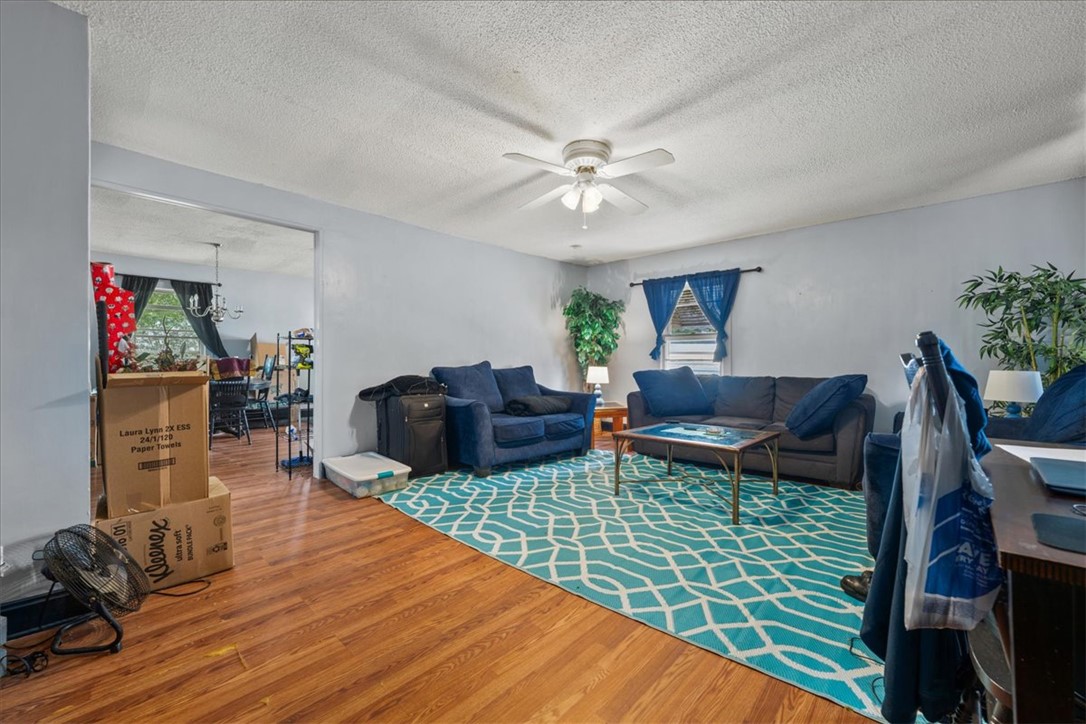 208 Holleman Street Seneca, SC 29678 - Photo 6 of 27 This inviting living space features warm flooring and ample natural light, perfect for everyday living.
