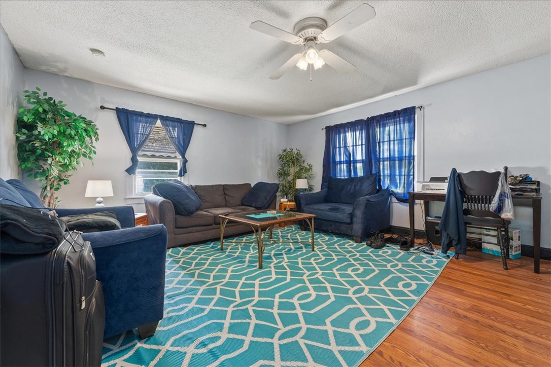 208 Holleman Street Seneca, SC 29678 - Photo 8 of 27 This inviting living area features hardwood flooring and abundant natural light.
