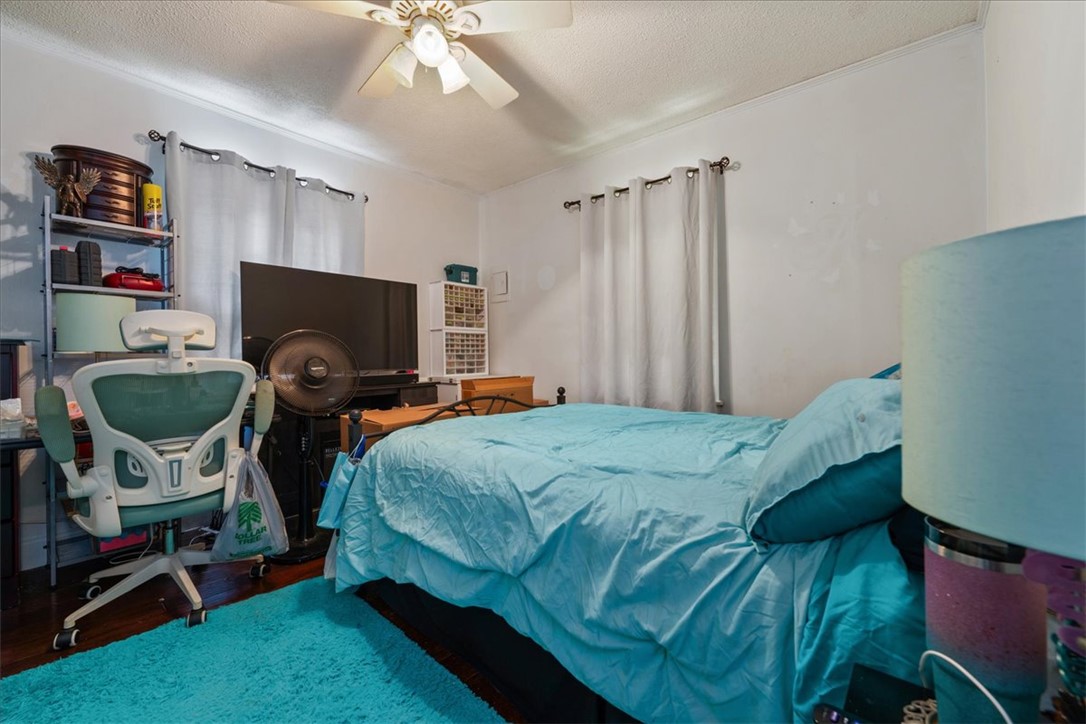 208 Holleman Street Seneca, SC 29678 - Photo 10 of 27 This cozy bedroom features warm lighting and practical amenities.