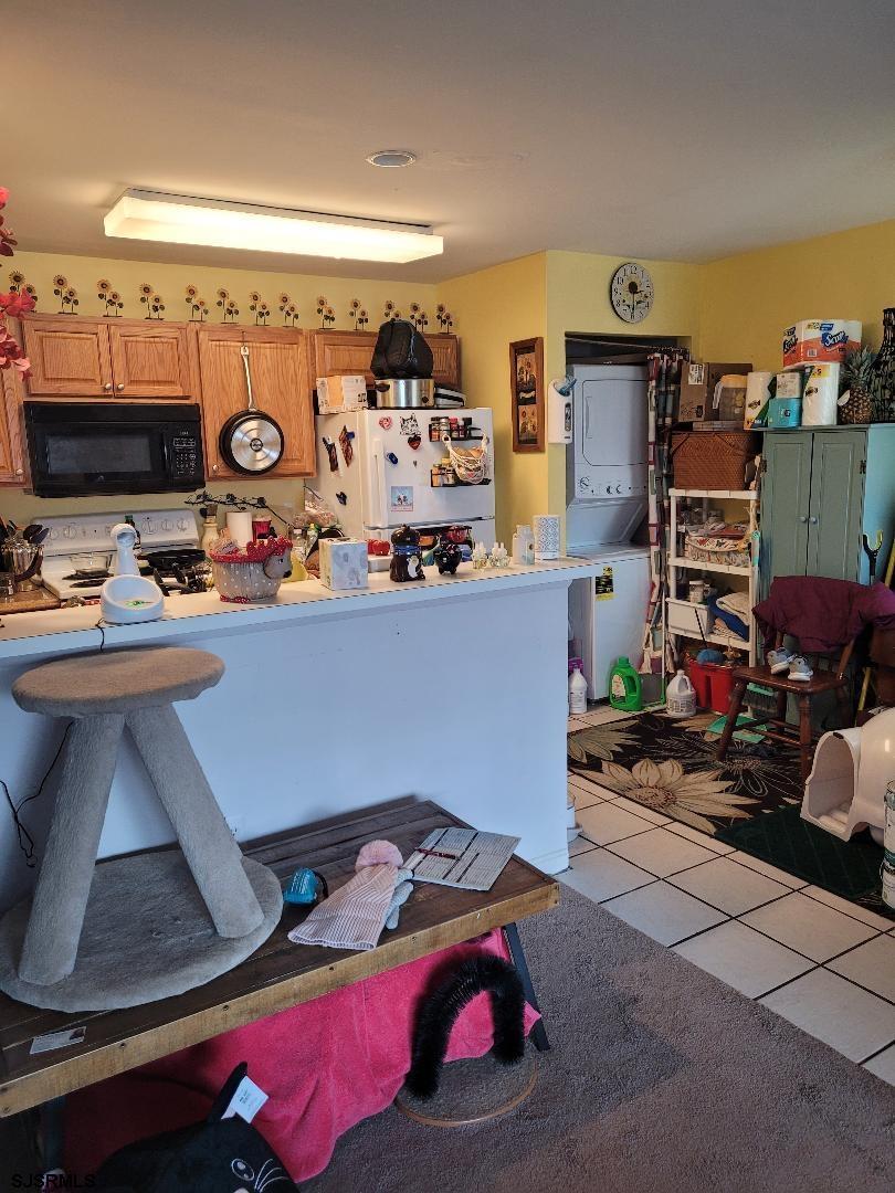 14 Meadow Ridge Road, Unit 14 Smithville, NJ 08205 - Photo 6 of 8 a room with furniture a flat screen tv and a window