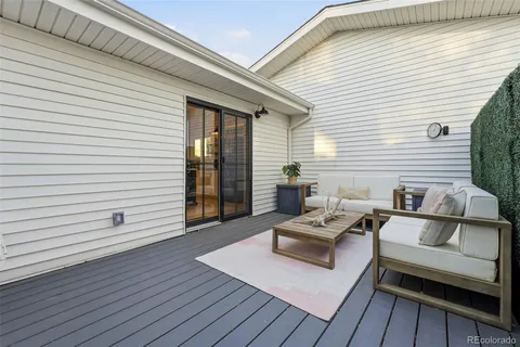 a view of a house with a yard porch and sitting area