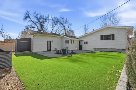 a front view of a house with large windows