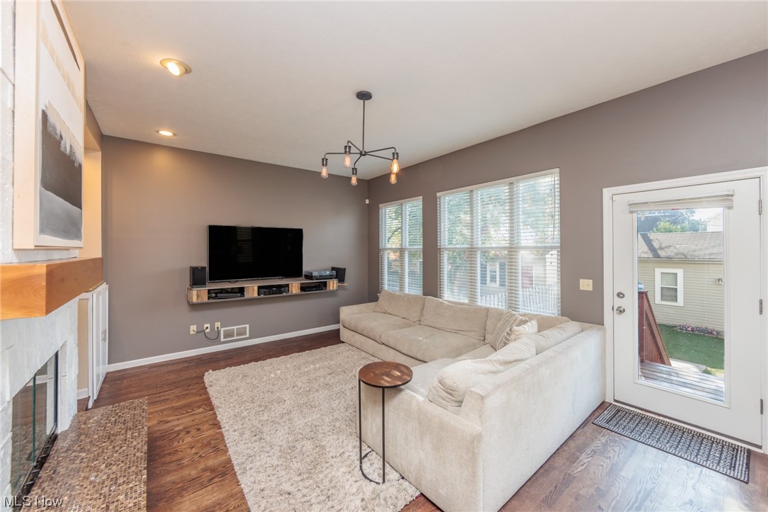 603 Literary Road Cleveland, OH 44113 - Photo 13 of 35 Hardwood floored living room with a chandelier and a premium fireplace