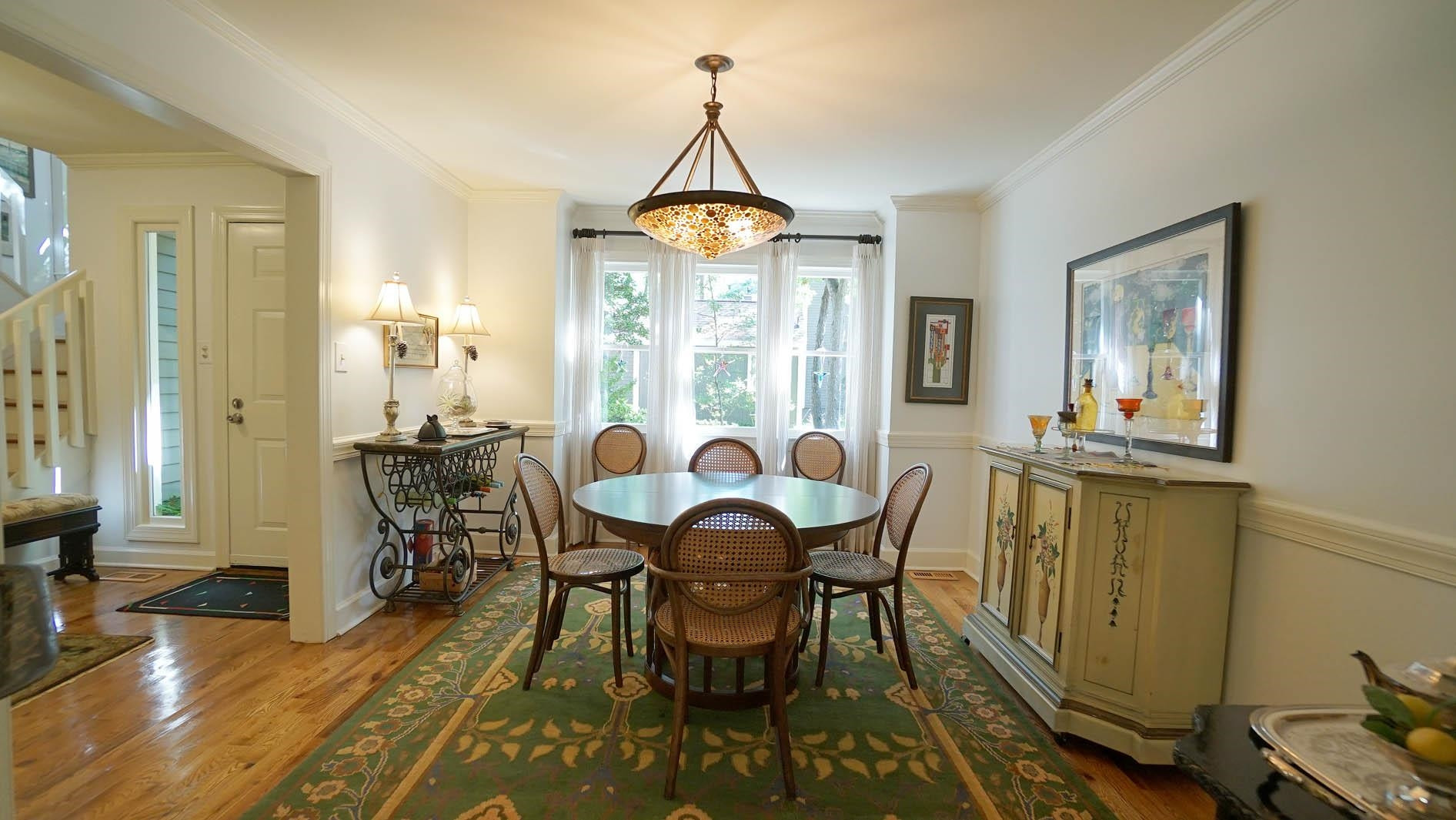 1809 Falls Church Road Raleigh, NC 27609 - Photo 12 of 56 a dining room with furniture window wooden floor