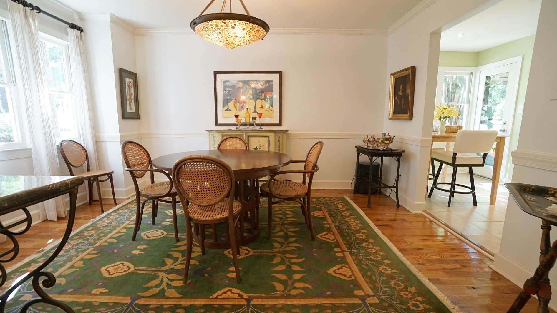 1809 Falls Church Road Raleigh, NC 27609 - Photo 13 of 56 a view of a dining room with furniture