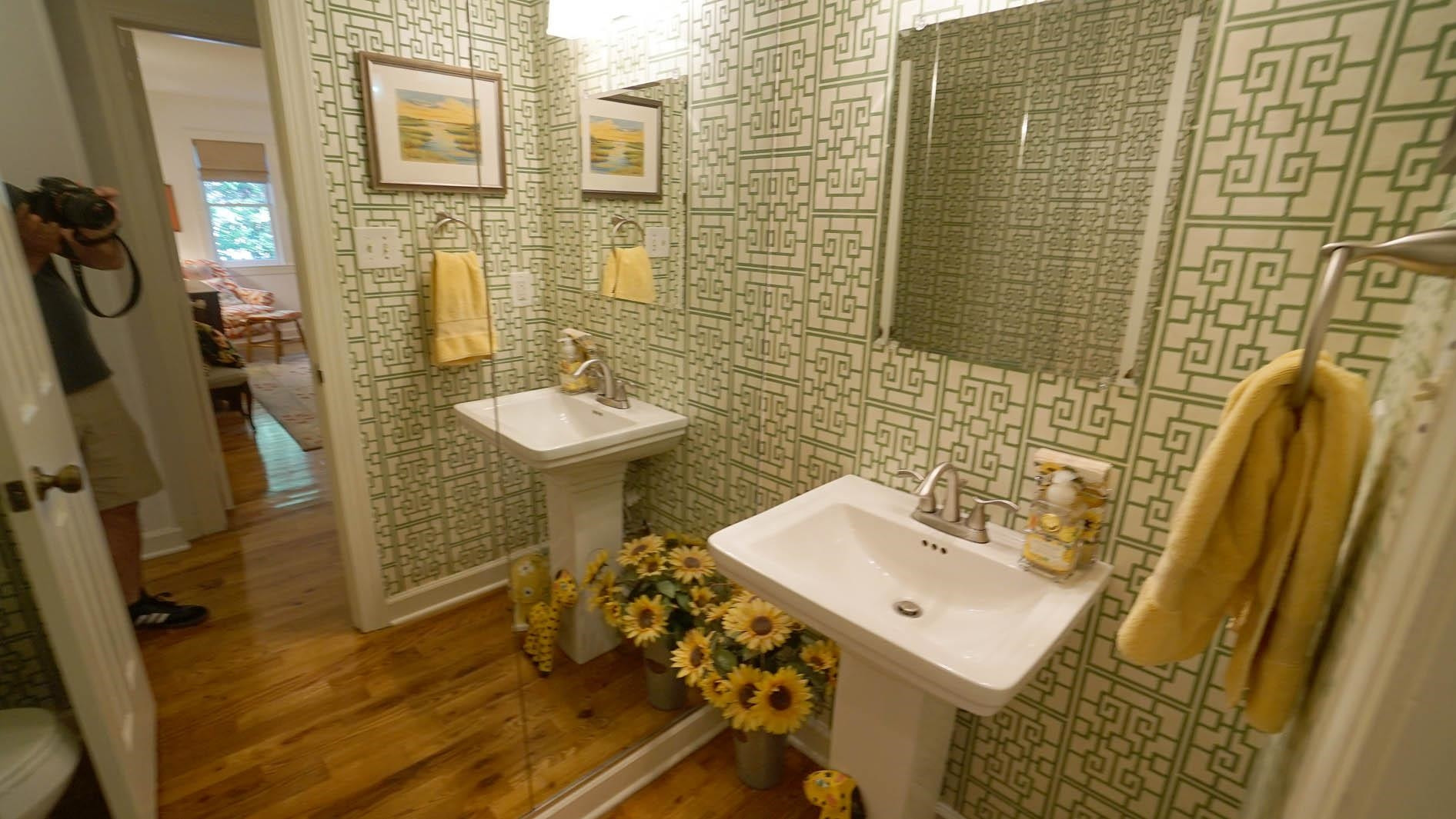 1809 Falls Church Road Raleigh, NC 27609 - Photo 15 of 56 a bathroom with a sink a toilet and shower