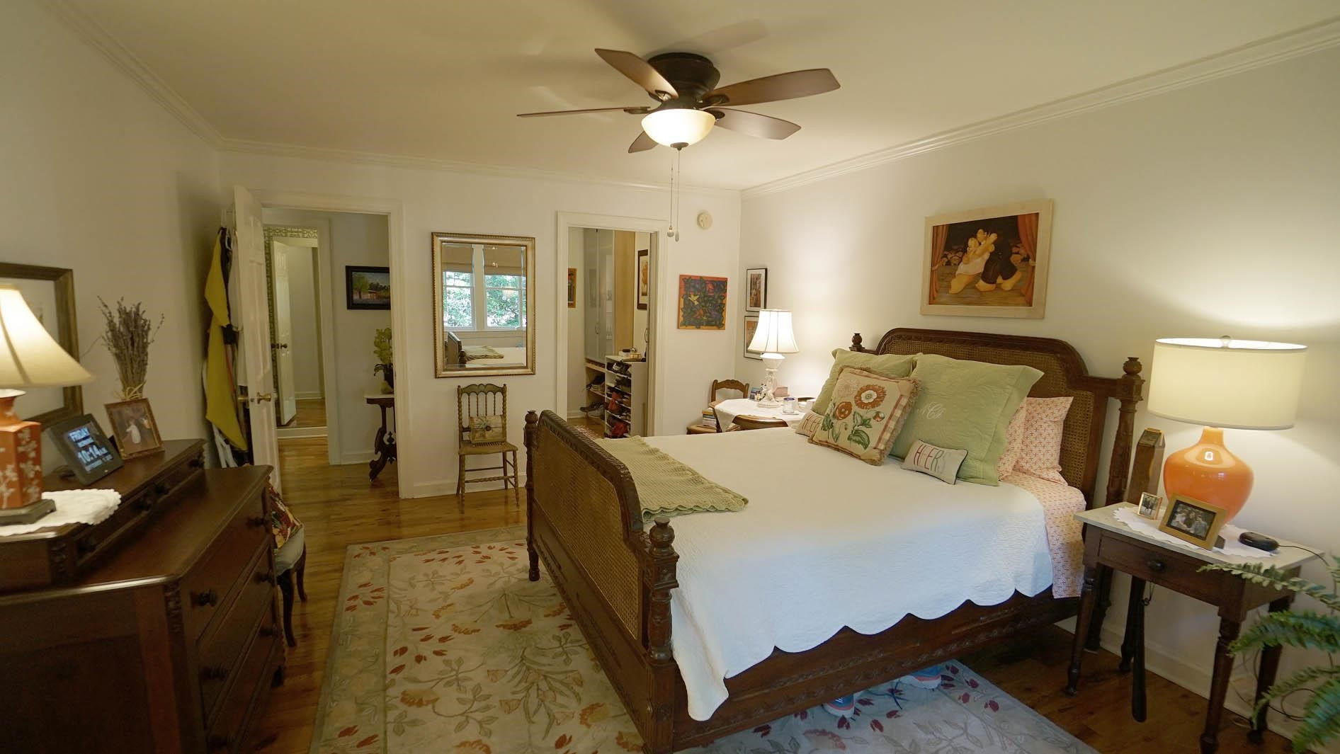 1809 Falls Church Road Raleigh, NC 27609 - Photo 17 of 56 a bedroom with a bed and wooden floor