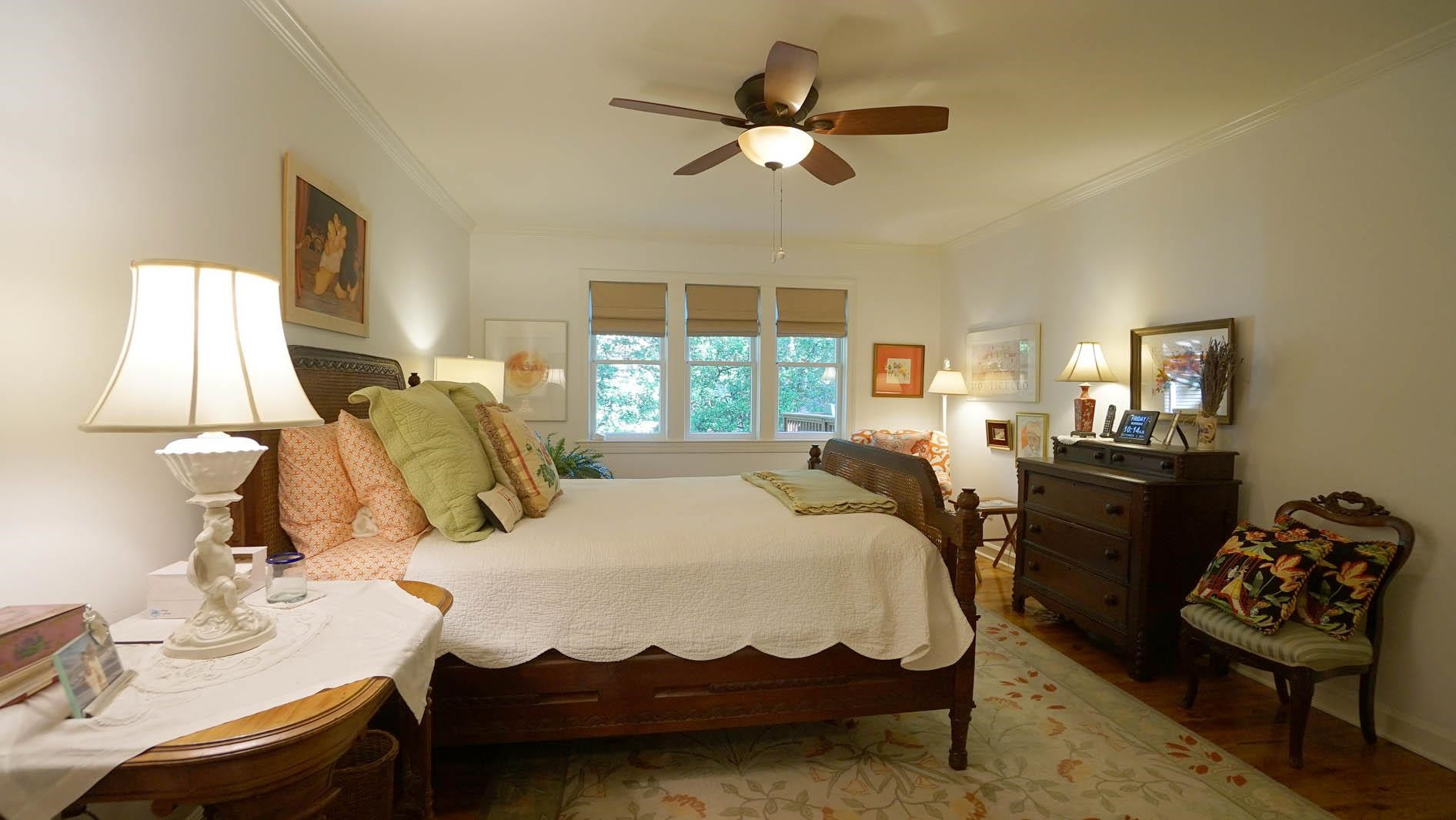 1809 Falls Church Road Raleigh, NC 27609 - Photo 18 of 56 a bedroom with a bed and wooden floor
