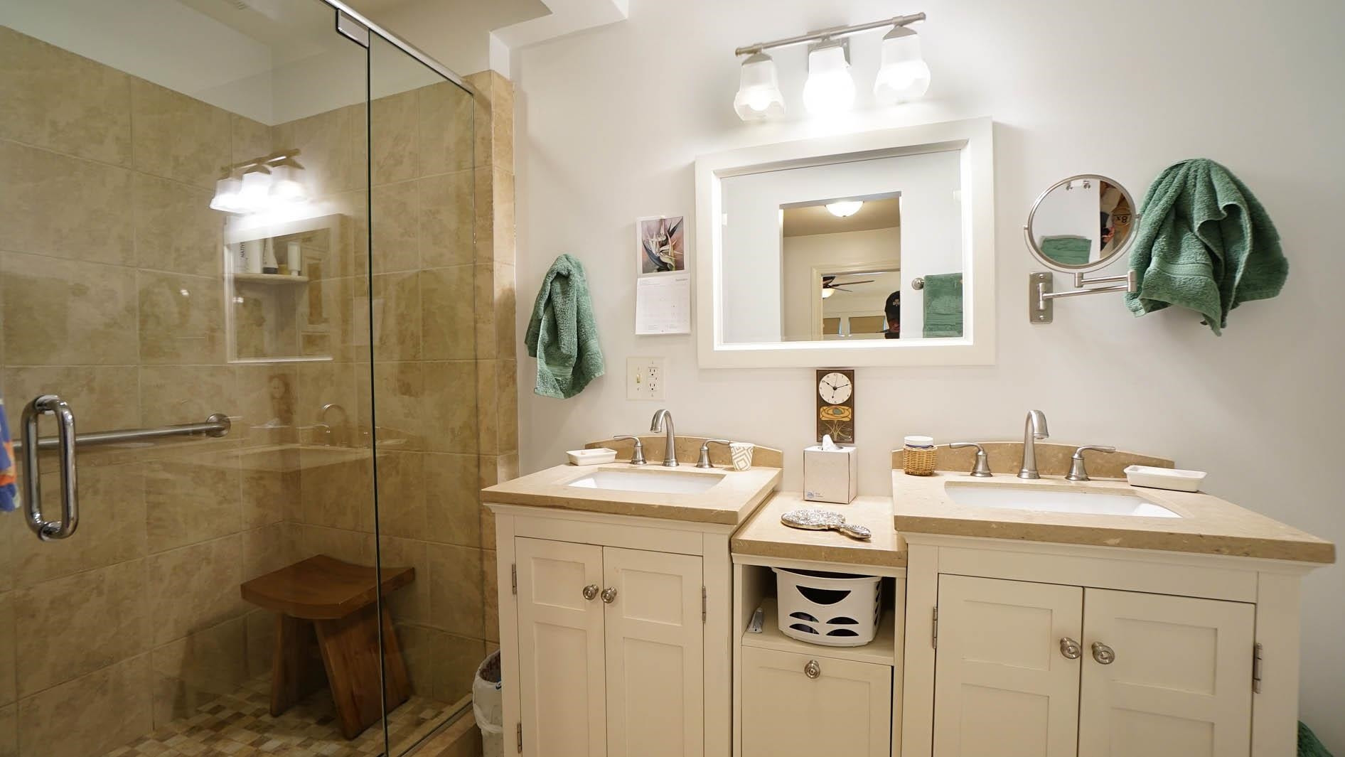 1809 Falls Church Road Raleigh, NC 27609 - Photo 19 of 56 a bathroom with a sink and a mirror