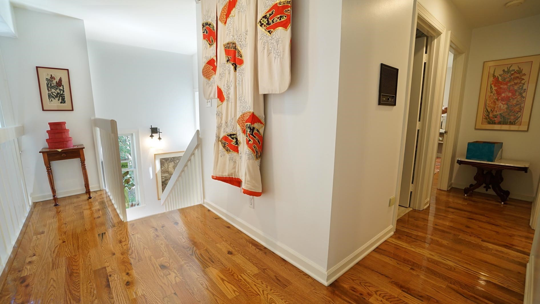 1809 Falls Church Road Raleigh, NC 27609 - Photo 34 of 56 a view of a hallway with wooden floor and furniture