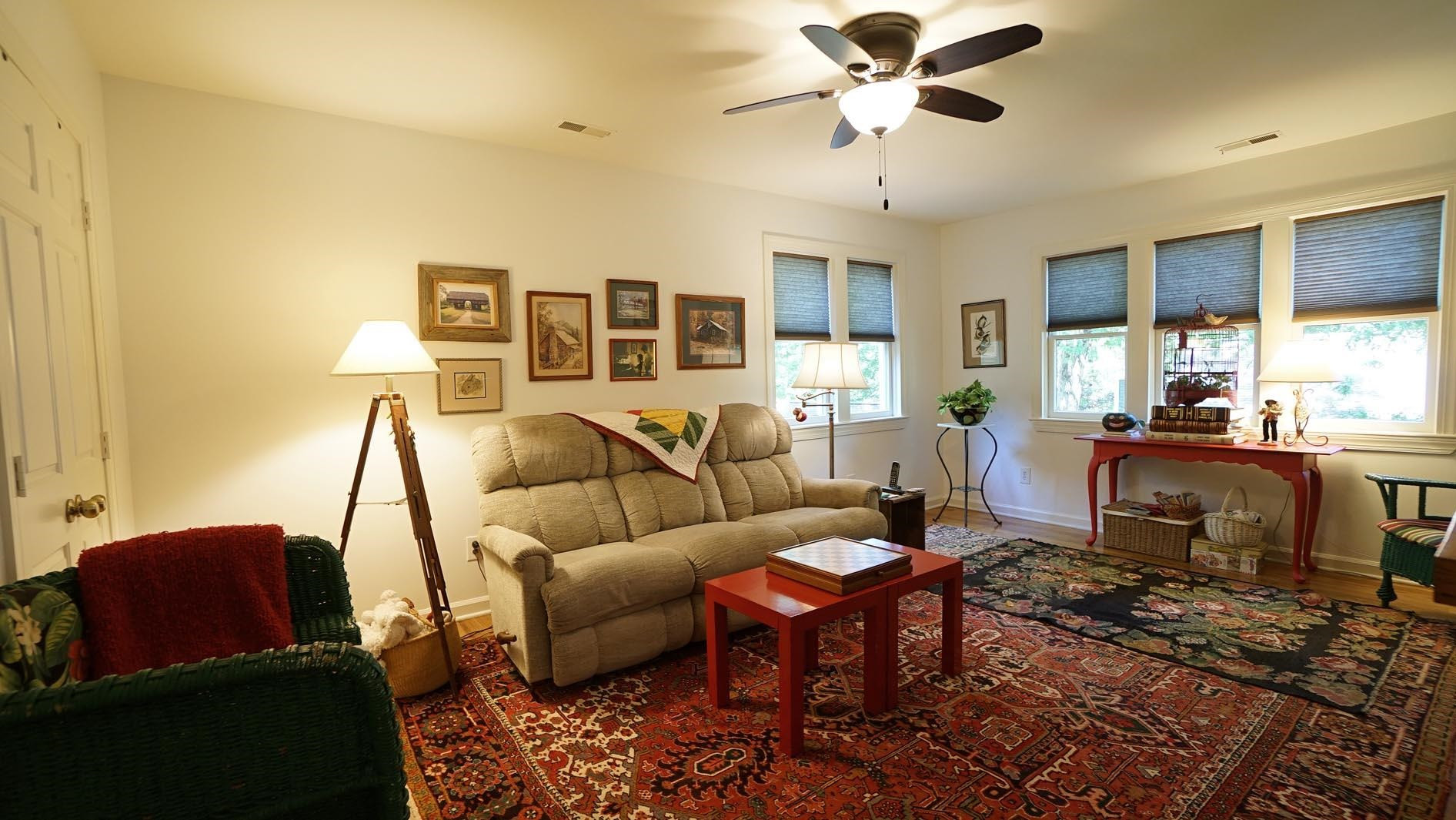 1809 Falls Church Road Raleigh, NC 27609 - Photo 36 of 56 a living room with furniture and a chandelier