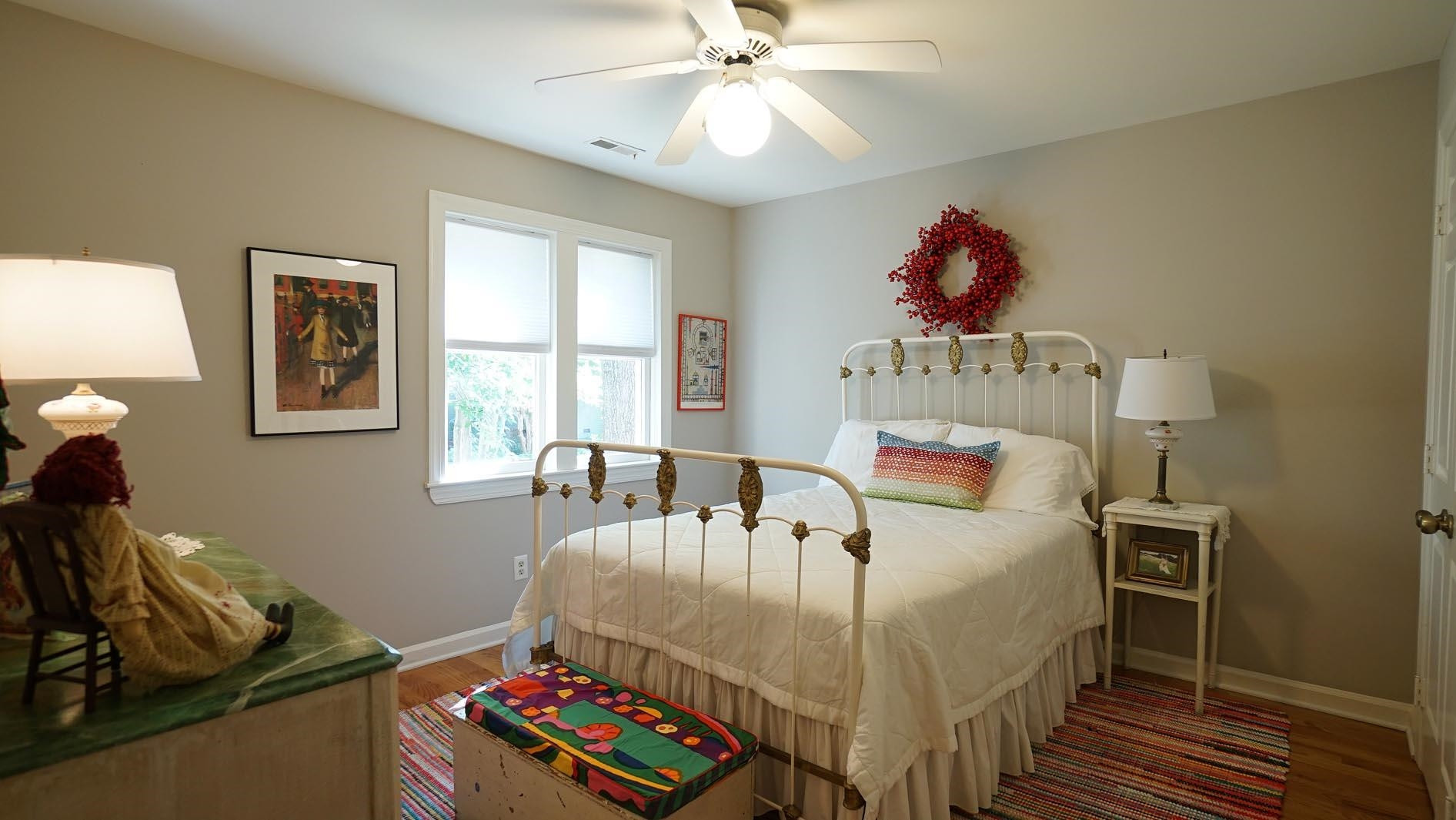 1809 Falls Church Road Raleigh, NC 27609 - Photo 38 of 56 a bedroom with a bed and wooden floor