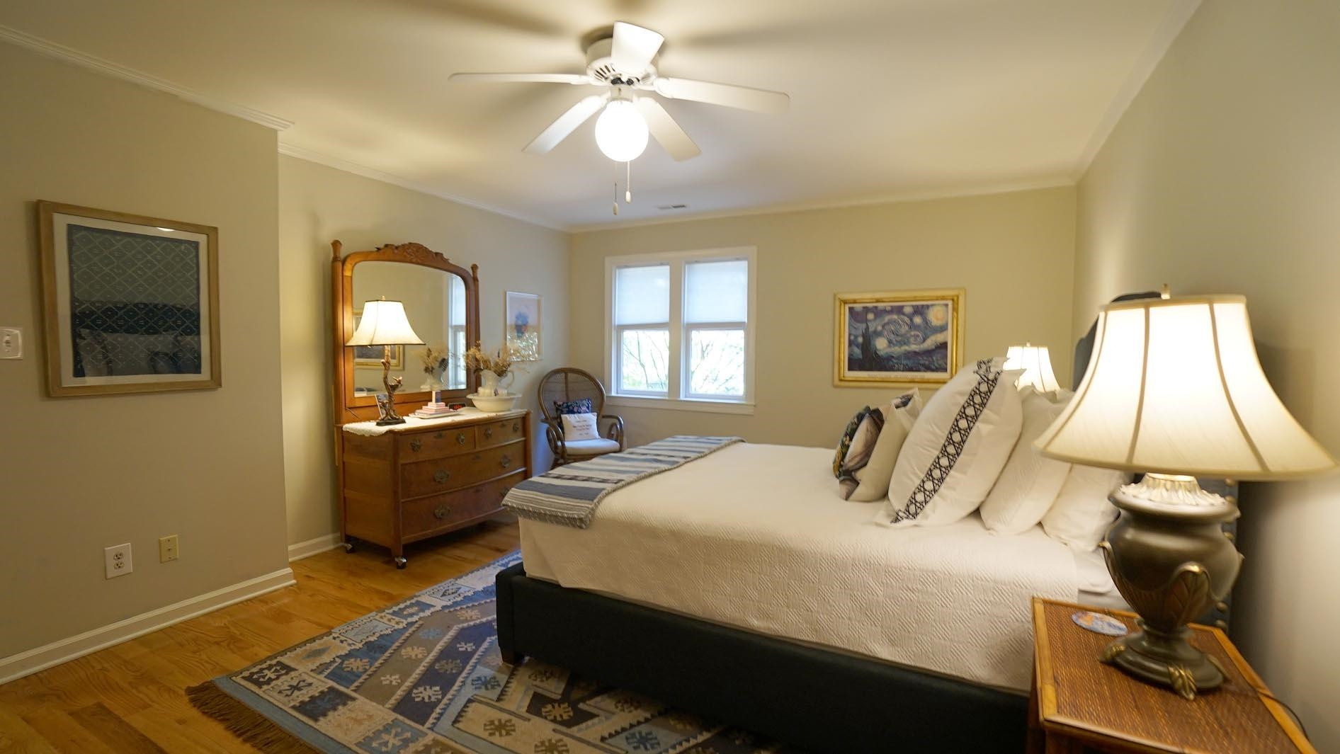 1809 Falls Church Road Raleigh, NC 27609 - Photo 39 of 56 a bedroom with a bed and wooden floor