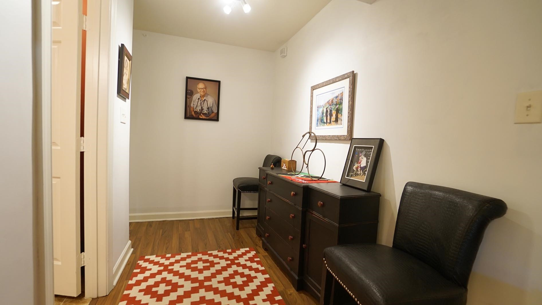 1809 Falls Church Road Raleigh, NC 27609 - Photo 41 of 56 a view of a hallway with workspace and wooden floor